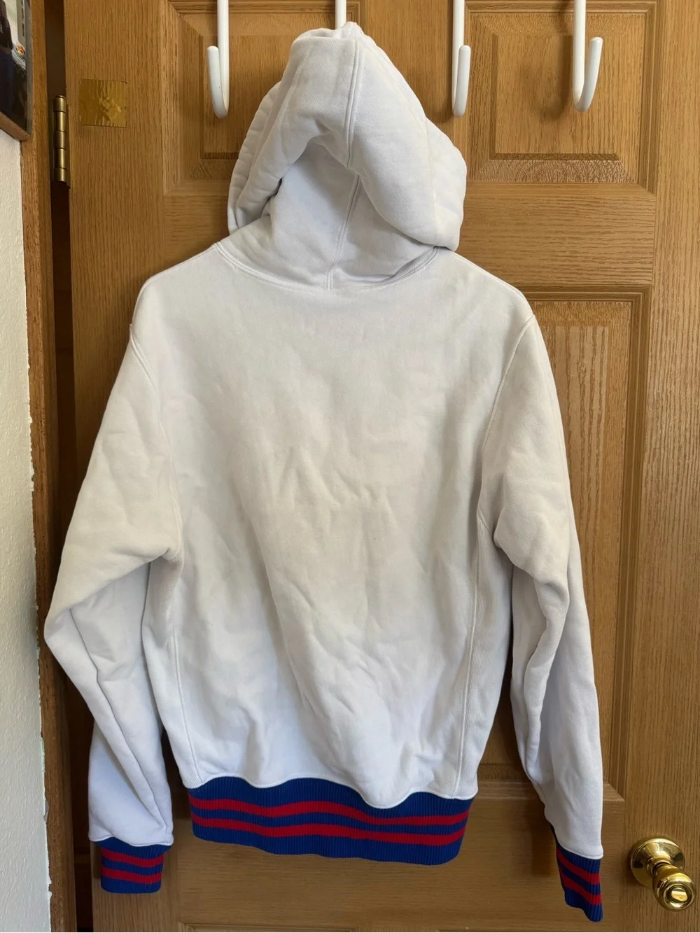 Champion White Hoodie with Blue Script and Red-Blue Ribbing